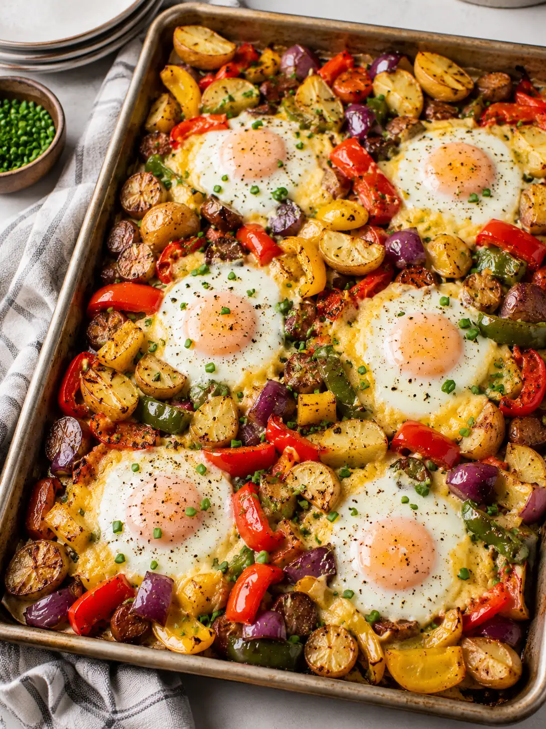 Sheet pan baked eggs with vegetables and cheese